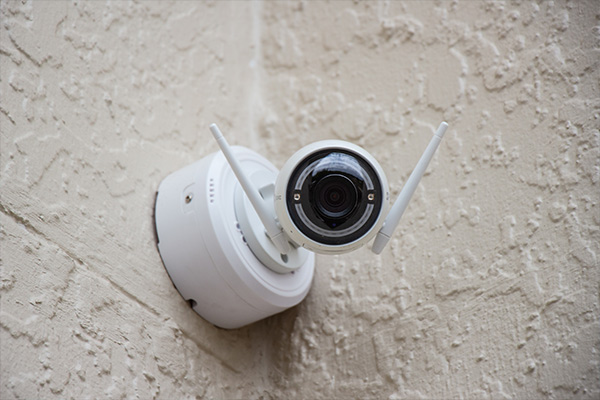 Security iot camera mounted to the wall  


