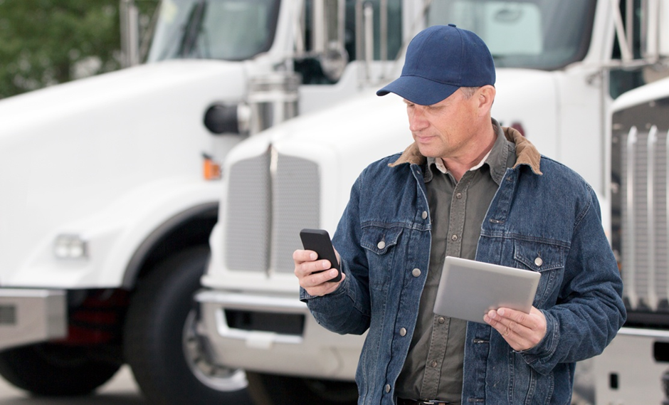 A man looks on his mobile devices