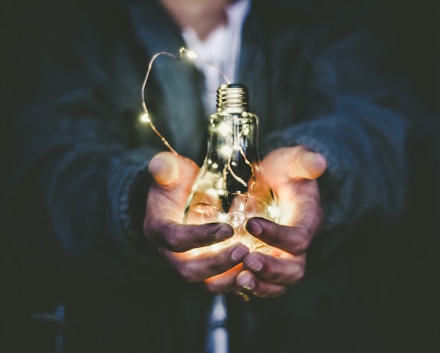 Man holding lighting bulb