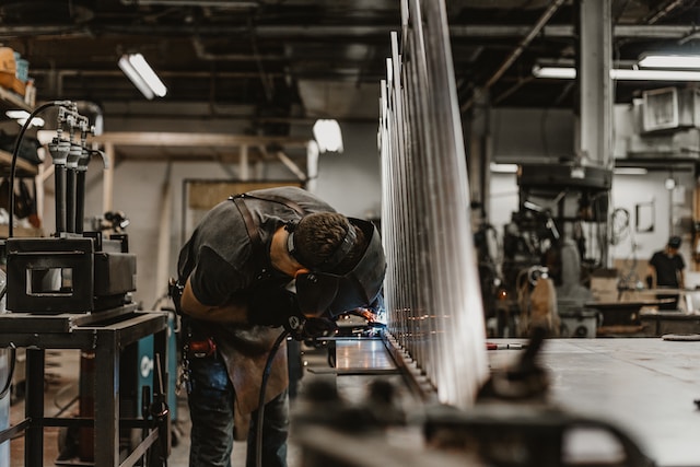a man's working in manufacturing