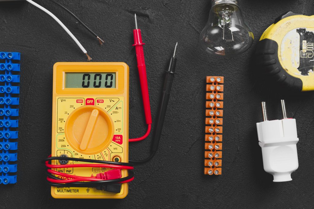 Multimeter and electrical instruments on table