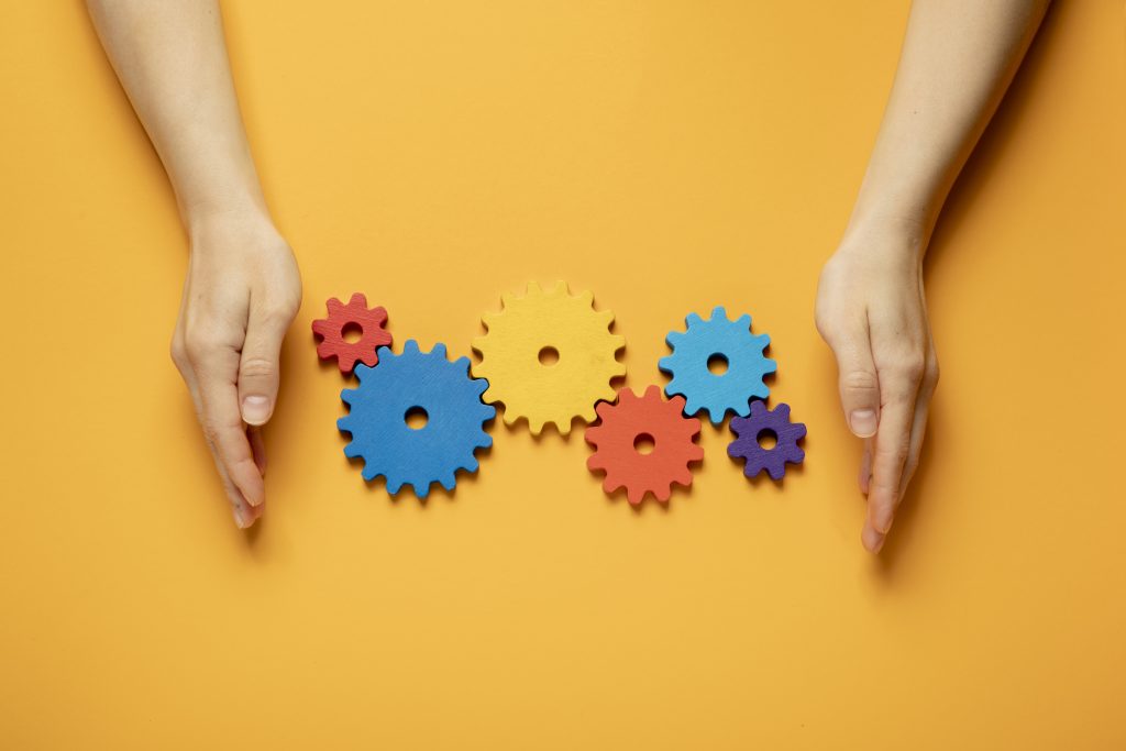 Colorful cogwheels arrangement flat lay