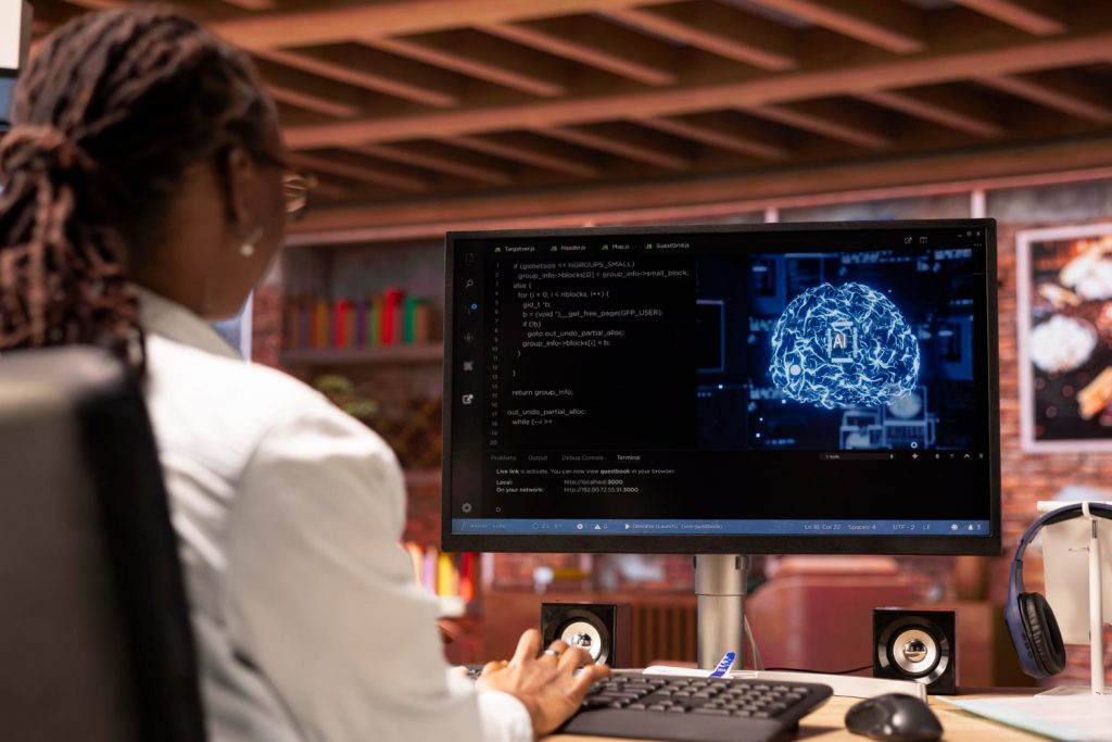 Ladie works one the workstation with GenAI on her screen